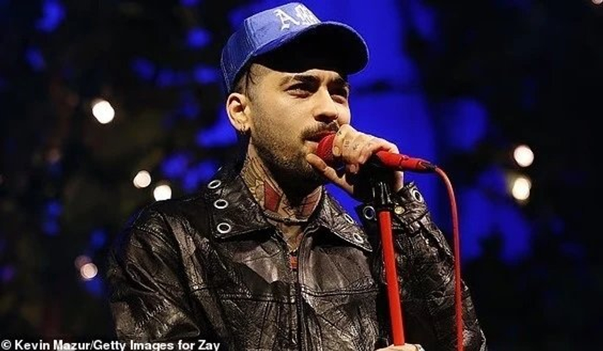 Zayn Malik përballet me një tjetër incident gjatë rikthimit të tij  fansi i hedh shishe uji në Londër